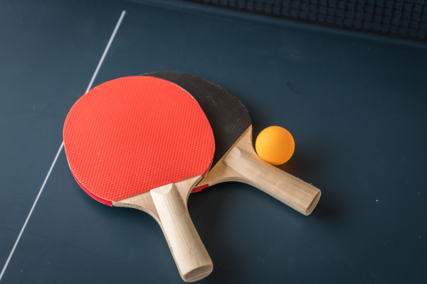Close up image of table tennis rackets and ball