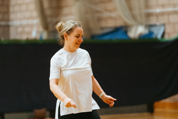 Woman dancing in a white t-shirt